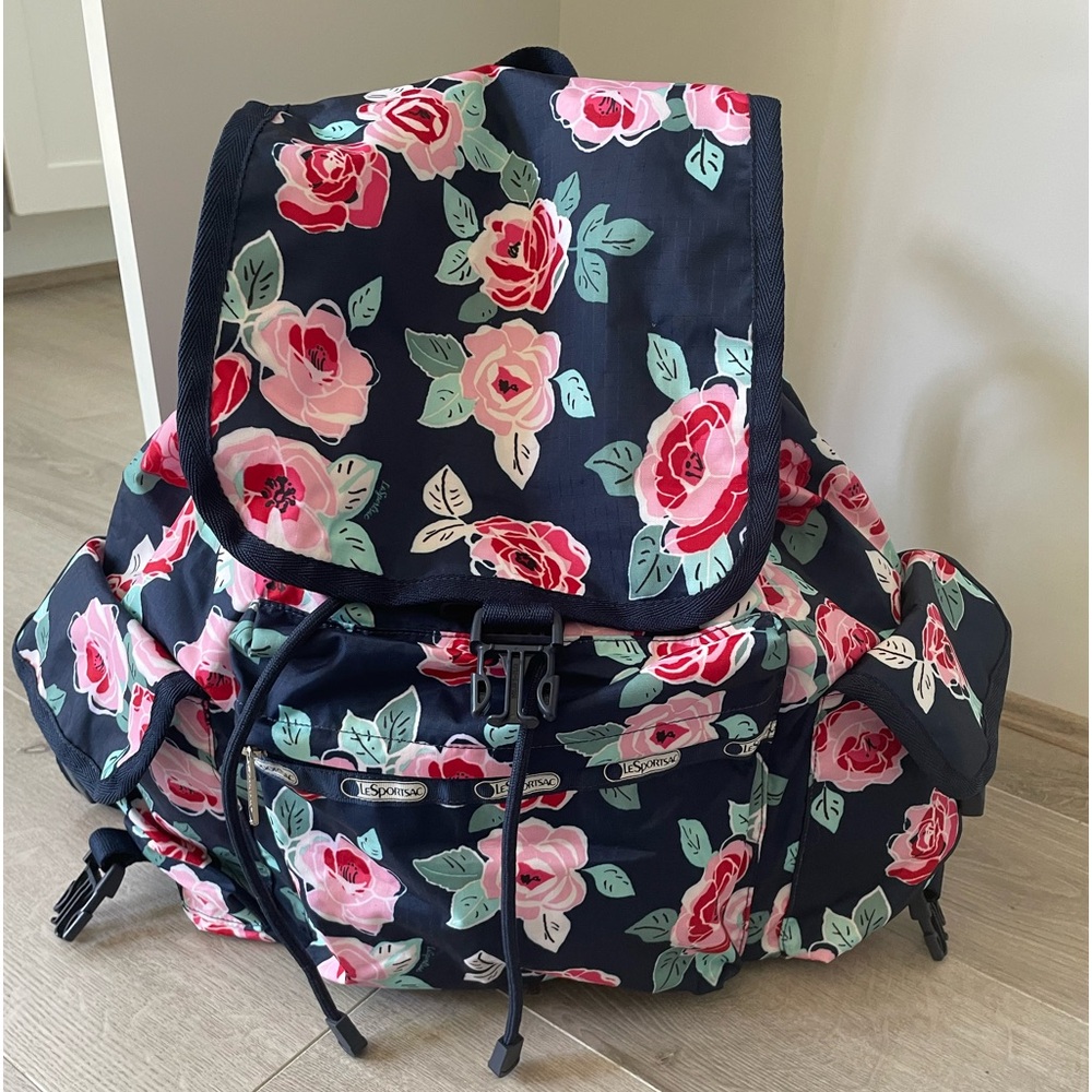 EUC Lesportsac Roses Backpack with navy background